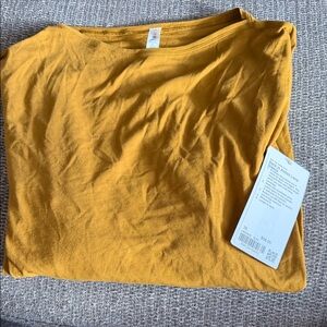 Lululemon Mustard Yellow long sleeve T-Shirt. Back in action long sleeve